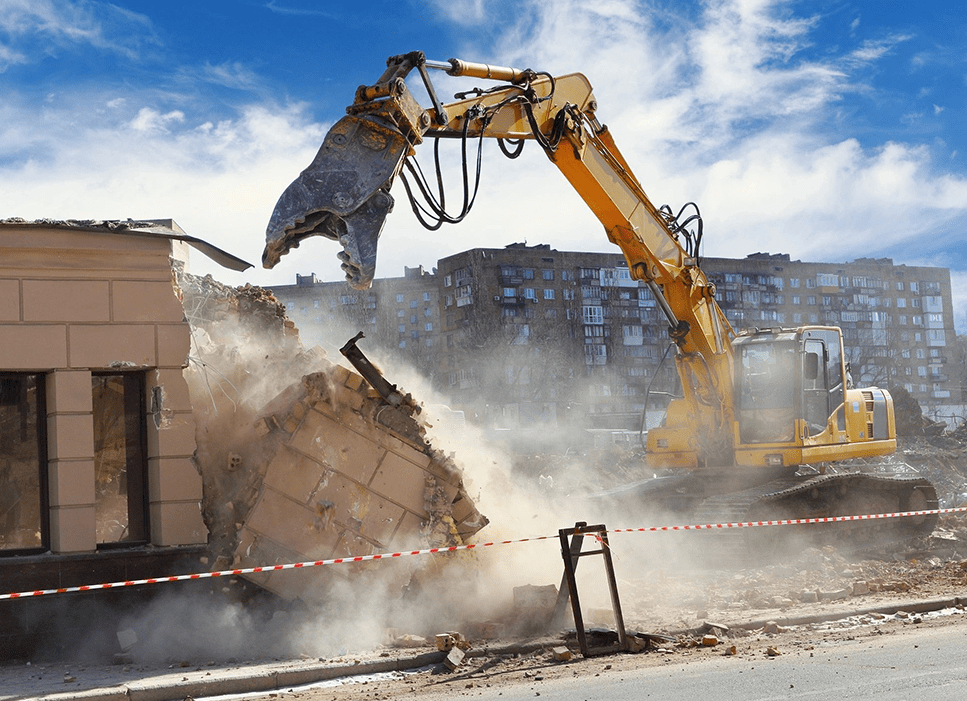 A yellow and black excavator is on the ground