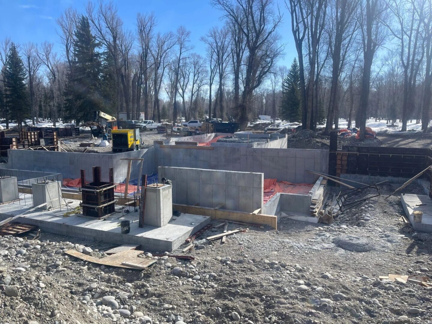 A construction site with trees in the background.